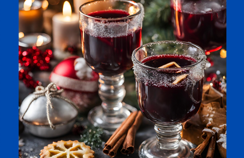 Image of Mulled Wine, mince pies and candles. 