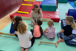 MP Caroline Ansell with a group of young children at Meads Sports Centre